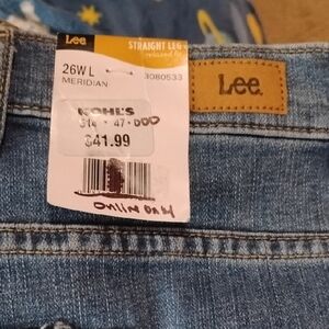 Size 26W Long lee Denim Jeans in Light Blue with Leather Logo Patch